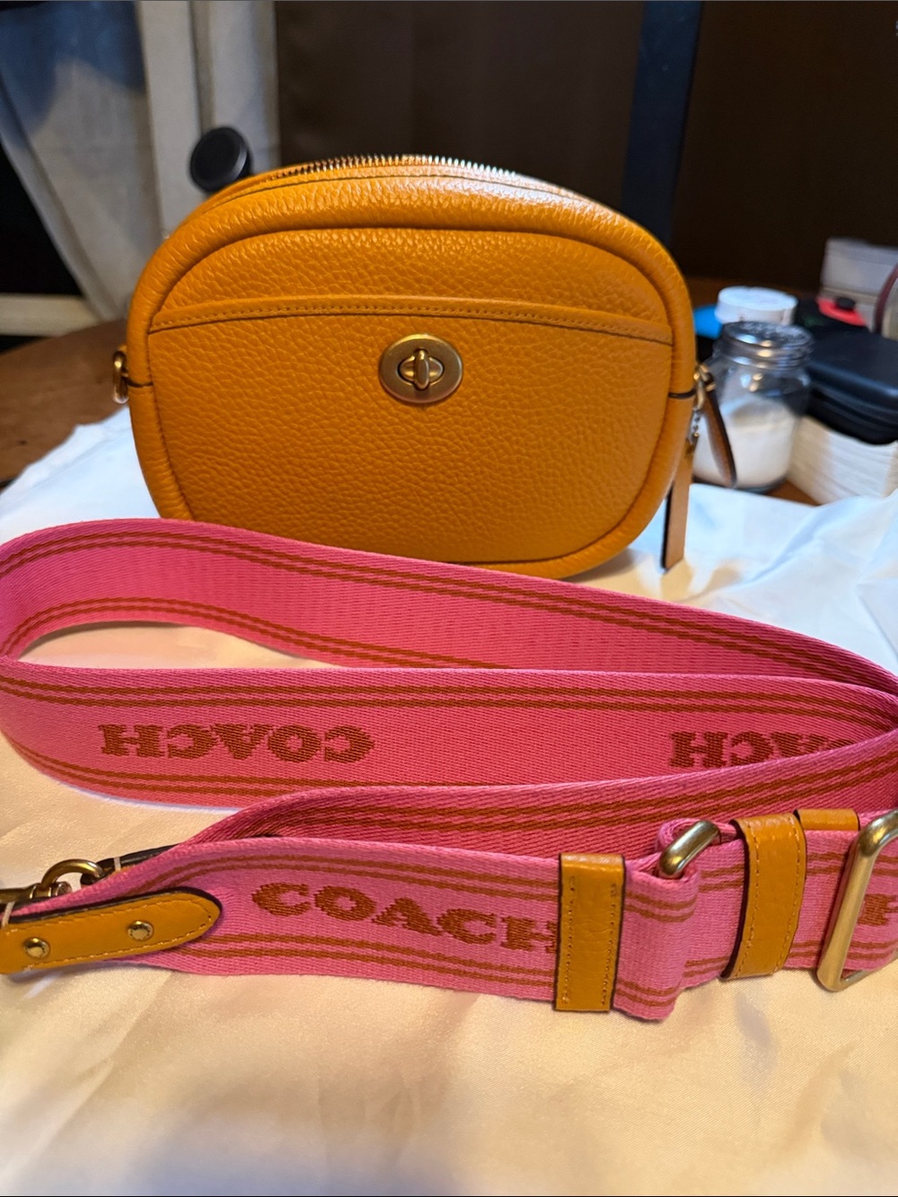 Coach Yellow Pebbled Leather Crossbody with Pink Logo Strap
